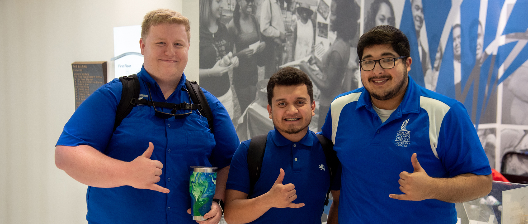 Male students wearing blue