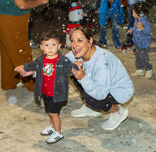 child playing in snow flurries